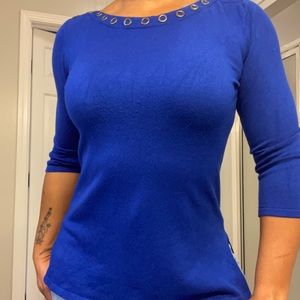 Cute blue sweater with silver gray rings around the neck.